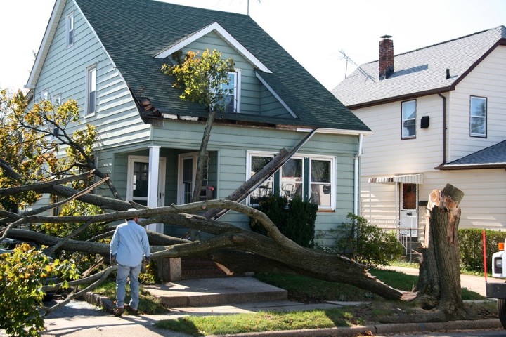 Storm damage to roof by Legacy Construction & Roofing